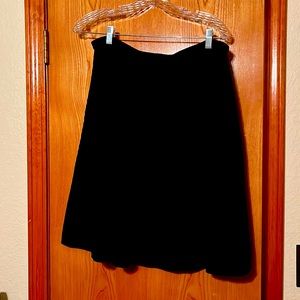Black CAbi knee length skirt.